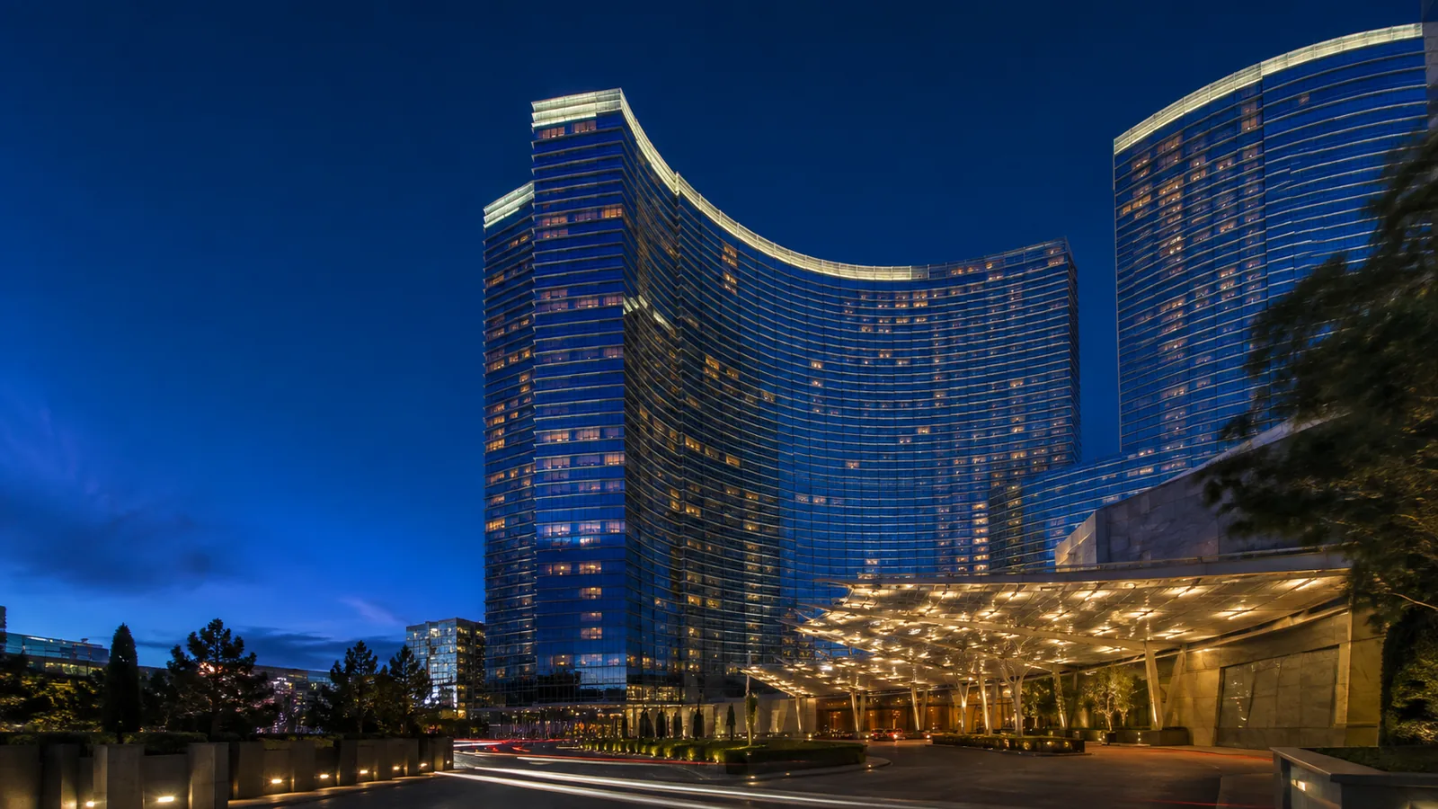 Editorial blue-hour exterior view inspired by ARIA Resort & Casino in Las Vegas