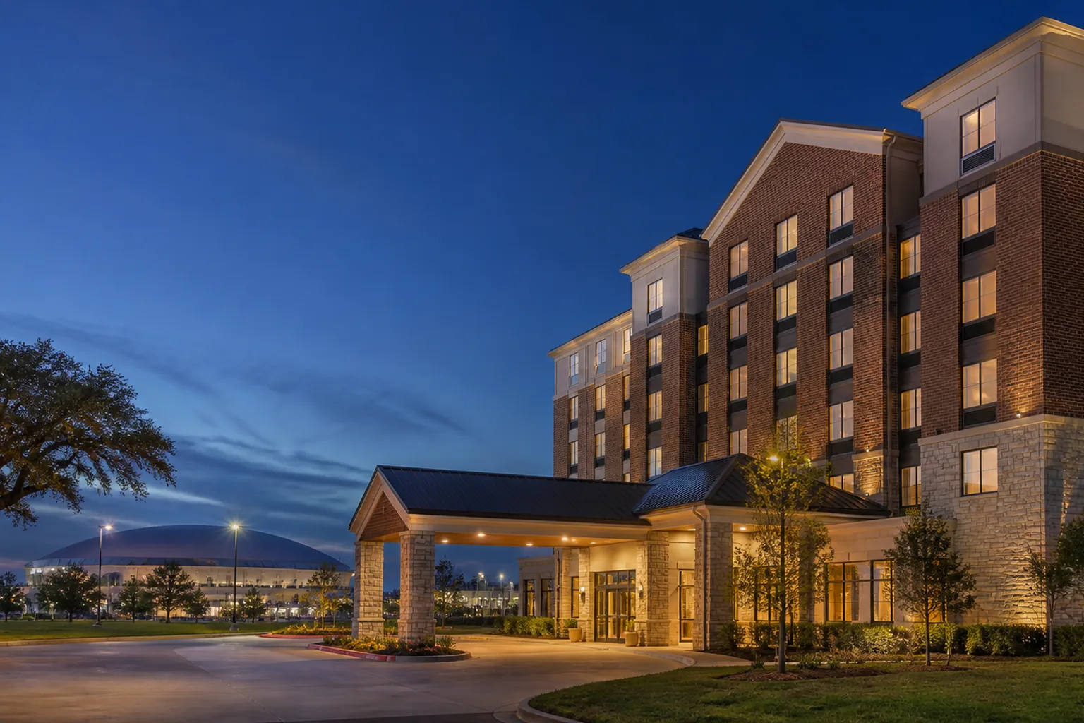 Editorial architectural view of the event-week meeting rhythm at Hilton Garden Inn Lafayette/Cajundome