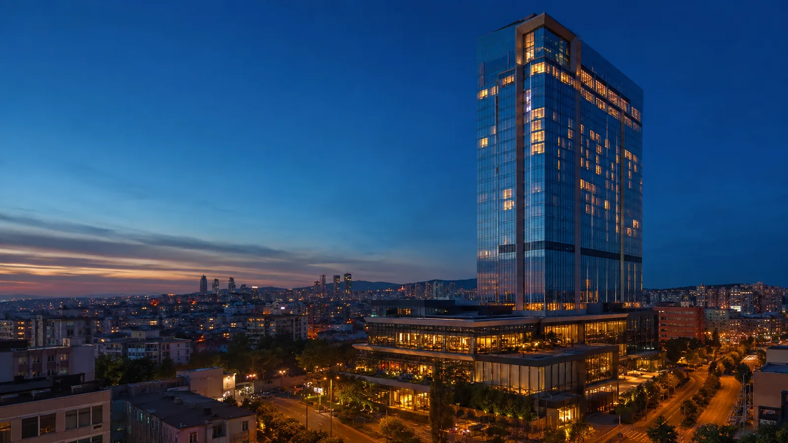 Editorial blue-hour exterior view inspired by Hilton Istanbul Bomonti in Istanbul
